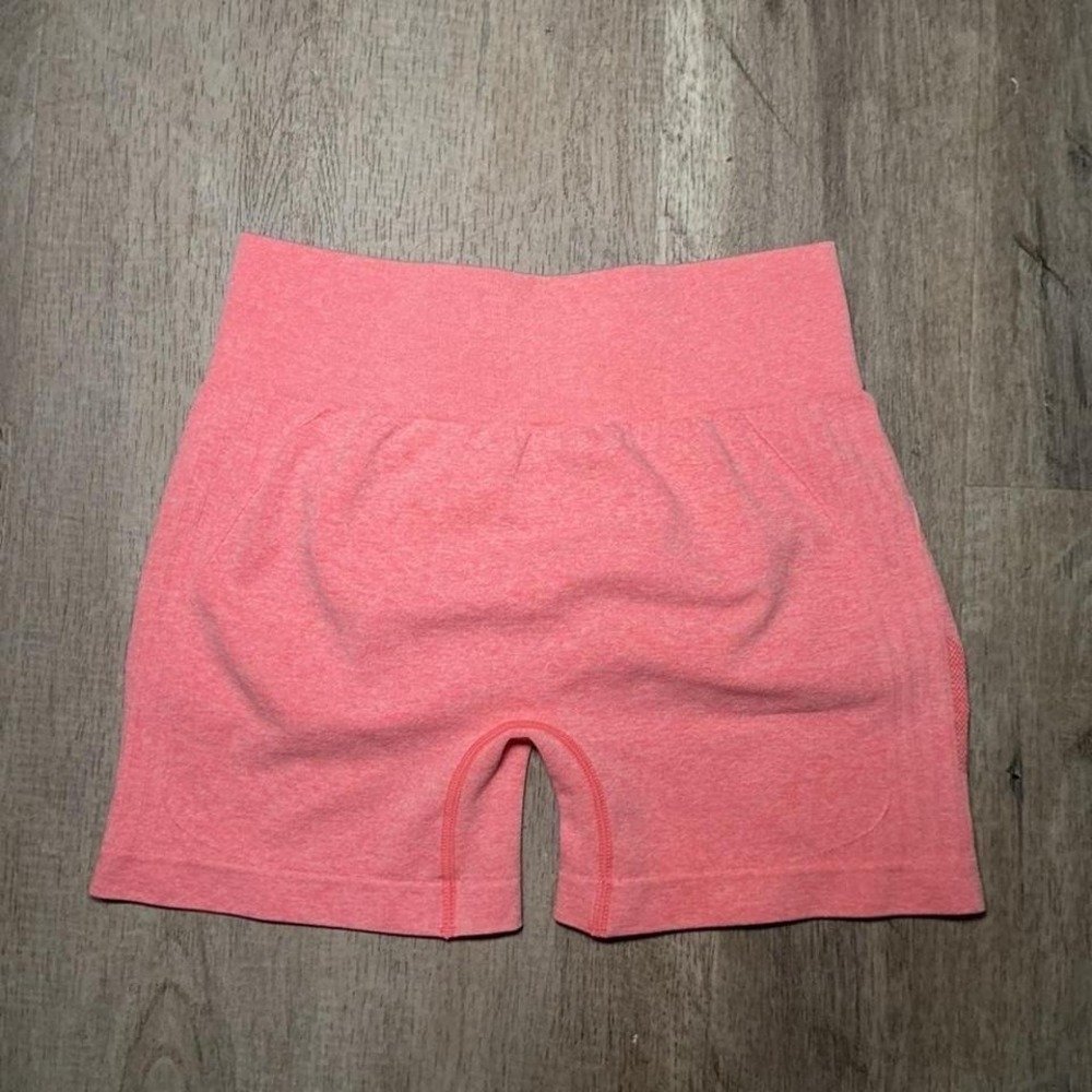 Pink high-waisted workout shorts with built-in shorts